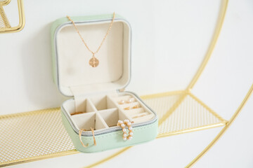 Jewelry box with stylish accessories on shelf