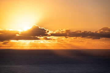 Beautiful sunset on the Atlantic Ocean off the coast of Madeira island, Portugal, seen from Fãja da Ovelha