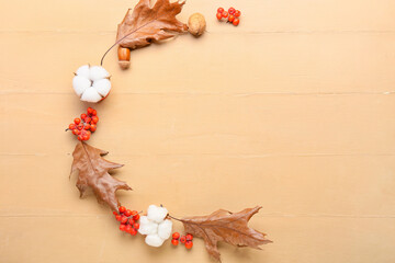 Beautiful autumn decor and cotton flowers on color wooden background