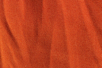 Fabric background with an orange fabric cloth polyester texture.