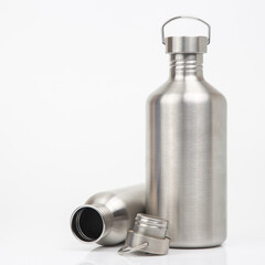 metal steel water flasks on white background. metal drinking utensils