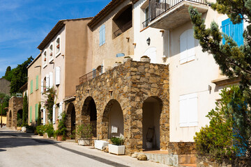 Fototapeta na wymiar Picturesque landscape of Grimaud village overlooking typical narrow streets on warm sunny autumn day, France.