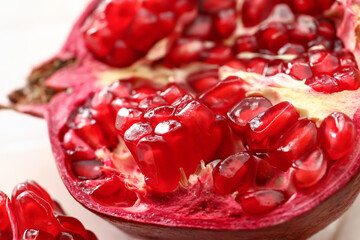 Ripe delicious pomegranate on light background
