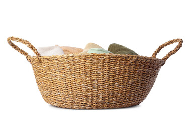 Wicker basket with sweaters on white background