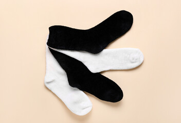 Black and white socks on color background