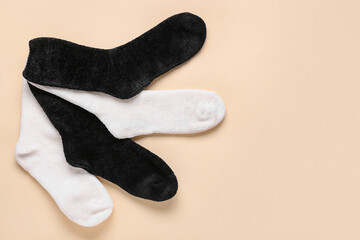 Black and white socks on color background