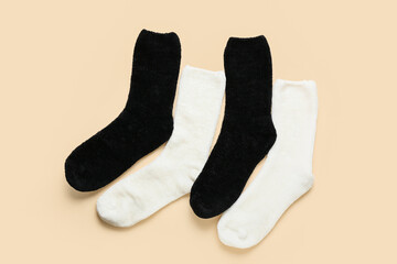 Black and white socks on color background