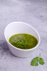 Green sauce in ceramic dishes