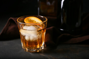 Glass of delicious Old Fashioned Cocktail on black background