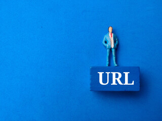 Top view miniature people with text URL on blue background