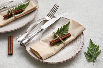 Elegant table setting with floral decor on light background