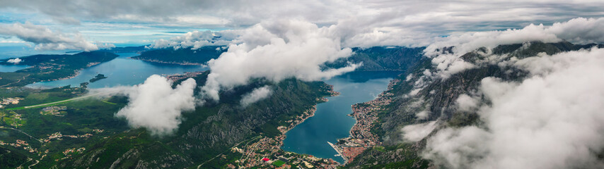 Naklejka na ściany i meble Aerial panoramic view of Kotor Bay from above the clouds, Montenegro