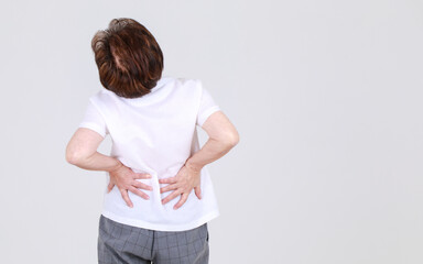 Elderly aunt stand tilt and twist with hands on waist as disappointed on body disease and tired of...