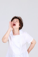 Elderly aunt stand tilt and twist with hands on waist as disappointed on body disease and tired of...