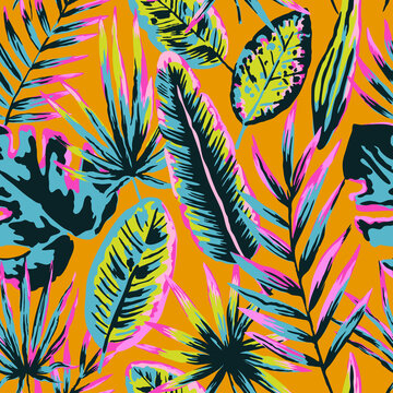 Seamless pattern with modern neon tropical leaves and plants for design and textile.