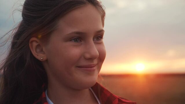portrait teen girl dreaming in the park at sunset. happy family kid face dream concept. teen kid girl portrait thinks about happiness. daughter dream sunset. kid dreaming