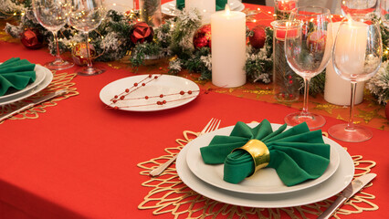 Beautiful table setting with Christmas decorations. Red colors