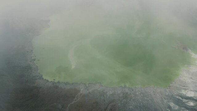 Aerial Of Emerald Green Sulfur-rich Lake In Crater of the active volcano El Chichon in Chiapas, Mexico - drone shot