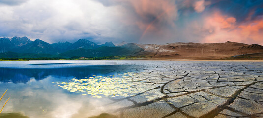 Landscape with mountains and a lake and a dried desert. Global climate change concept - 482765252