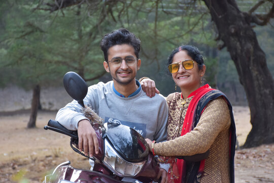 mother and his son in long trips , this is the way of india family chill out time in winter vacation ,family holiday chill out time with your two wheeler and enjoy .