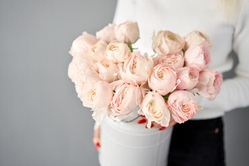 Pink buttercup. Bunch pink ranunculus flowers in woman hands.