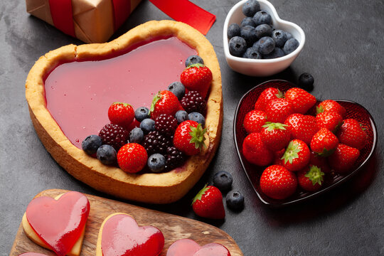 Heart shaped sweet cake with berries