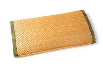 Straw woven pillow on white background