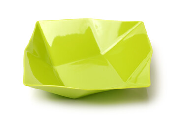 Bright green plastic empty bowl on a white background 