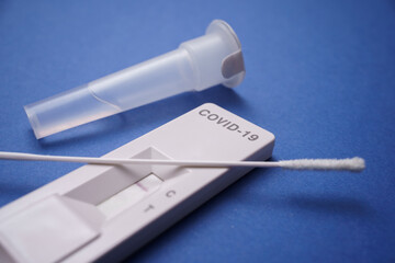 detail of the rapid self-test for COVID-19 with a negative coronavirus test result. Blue background