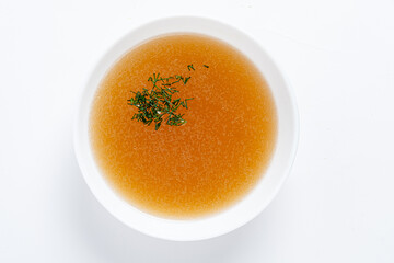 close up of a bowl of chicken broth