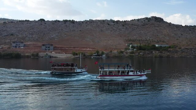 Boats With Tourists Sailing At Euphrates River Near Halfeti In Turkey. - aerial