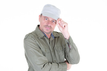 handsome middle aged man folded arms crossed and cap on white background