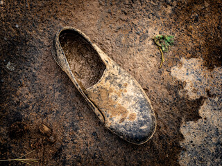 top down shoes that have fallen into the mud  © sasoriprastyo