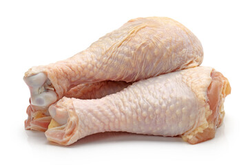 raw chicken legs on white.