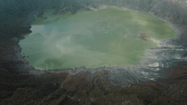 Green Sulfuric Lake At Bottom Of Crater At El Chichonal Volcano In Chiapas, Mexico - aerial drone shot
