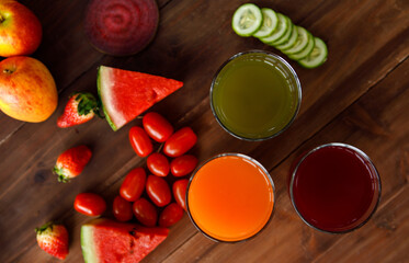 Top view close up shot of various kinds of healthy tasty nutritious fresh raw natural organic agriculture vegan vegetables and fruits ingredient diet placed on old colorful wooden table background