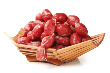 basket of small sausages on white background. © zcy