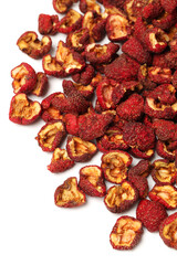 Dried chinese hawthorn fruit isolated over white background. Used in traditional herbal medicine. Crataegus.