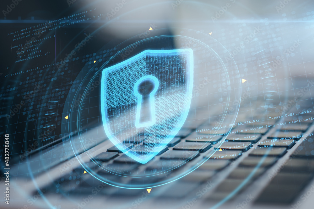 Poster close up of laptop with abstract glowing keyhole shield interface on blurry background. protection, 