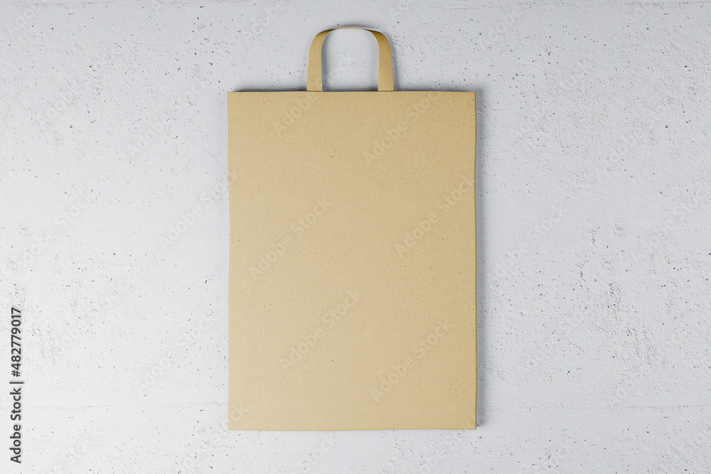 Poster Close up of empty paper bag on white backdrop. Mock up place for your advertisement or logo. 3D Rendering.