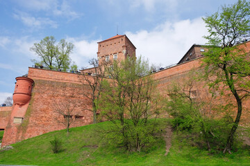 KRAKOW, MALOPOLSKIE POLAND - 30 April 2017: Tourists visit Wawel Royal Castle. View of the castle walls