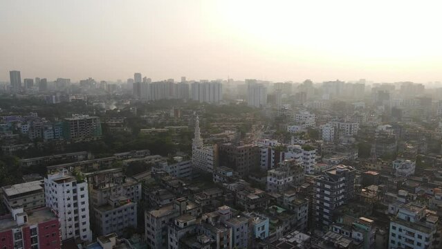 Aerial view of city surrounded by haze, South Asia cityscape