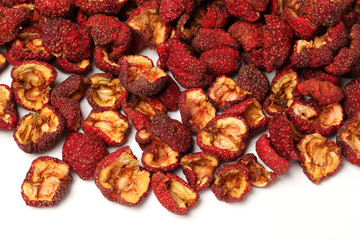 Dried chinese hawthorn fruit isolated over white background. Used in traditional herbal medicine. Crataegus.