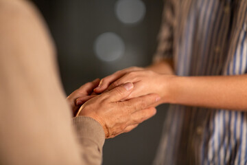 people, family and charity concept - close up of women holding hands