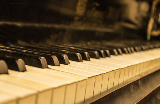 Keyboard of piano. Selective focus image. Warm color Music background