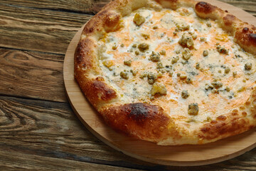 Italian Pizza Quattro formaggi. Italian pizza on wooden background