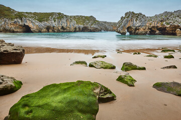 Picturesque rocky coastline in Asturias, Playa de las cuevas. Spain