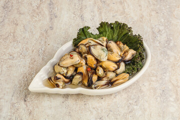 Tasty marinated mussels in the bowl