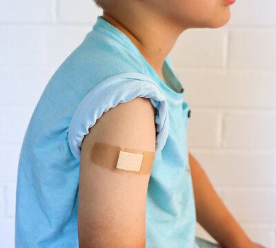 Child Bandaid After Vaccination.