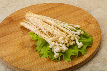 Raw Enoki mushrooms for cooking